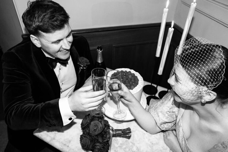 Joyful 'Just Married' Celebration with Champagne The newlyweds share a joyous toast with champagne, capturing the essence of their intimate elopement celebration.