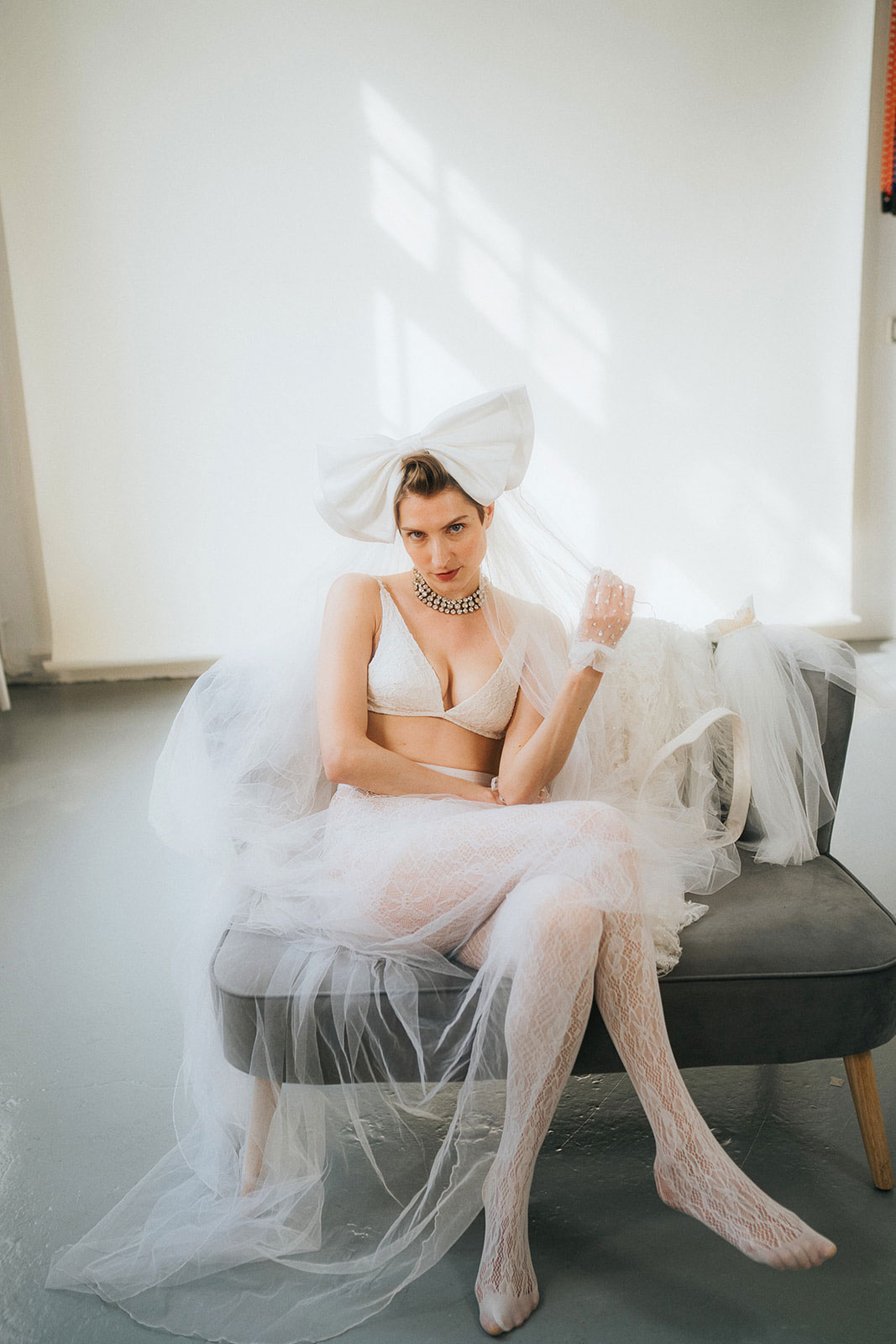 A model poses with a fabulous bow in her hair, a perfect photo to go with a blog on defining your ideal photographer.