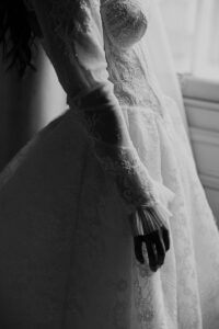 Cropped Black and white image of a bride wearing a lace wedding dress by Sophie Alexandria photography